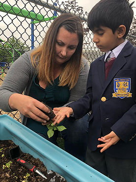 Showing%20Student%20how%20to%20Plant.jpg